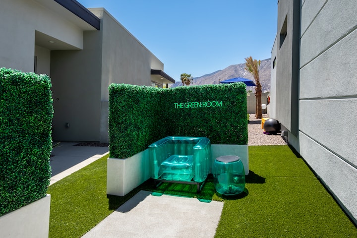 The Green Room, a hedge-walled meditation nook on the lawn with clear seats